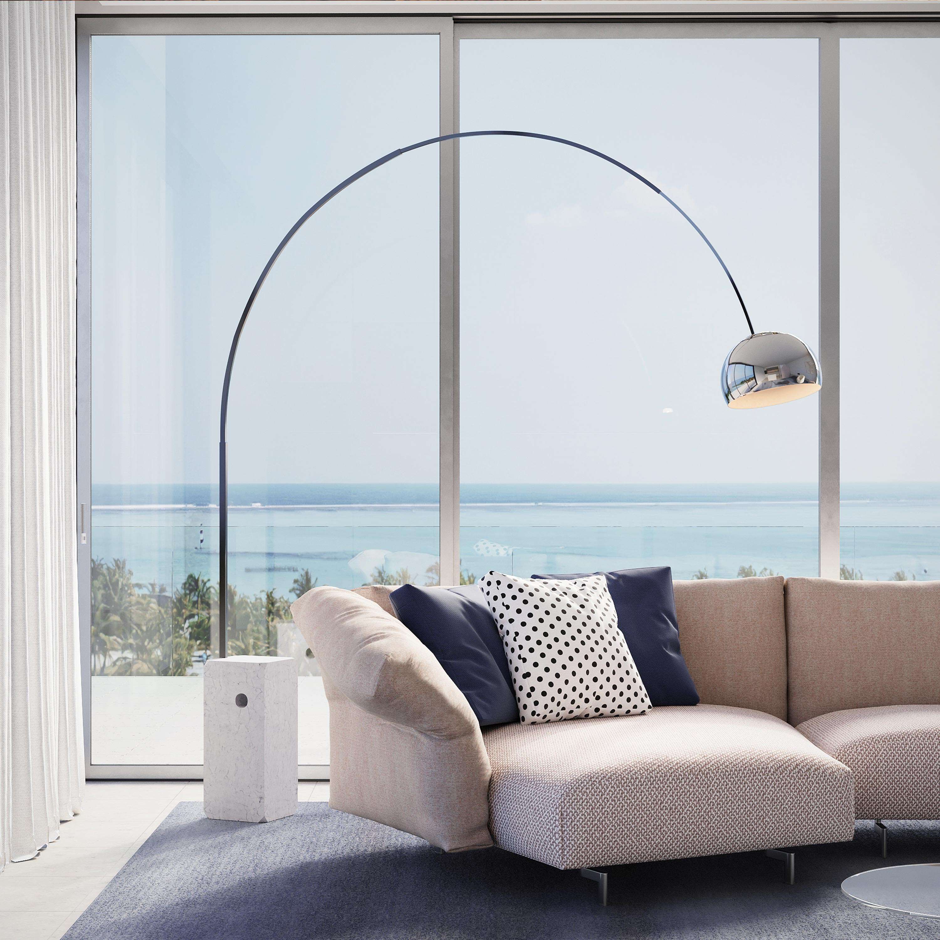 Flos Arco floor lamp with a white Carrara marble base and a long stainless steel arc