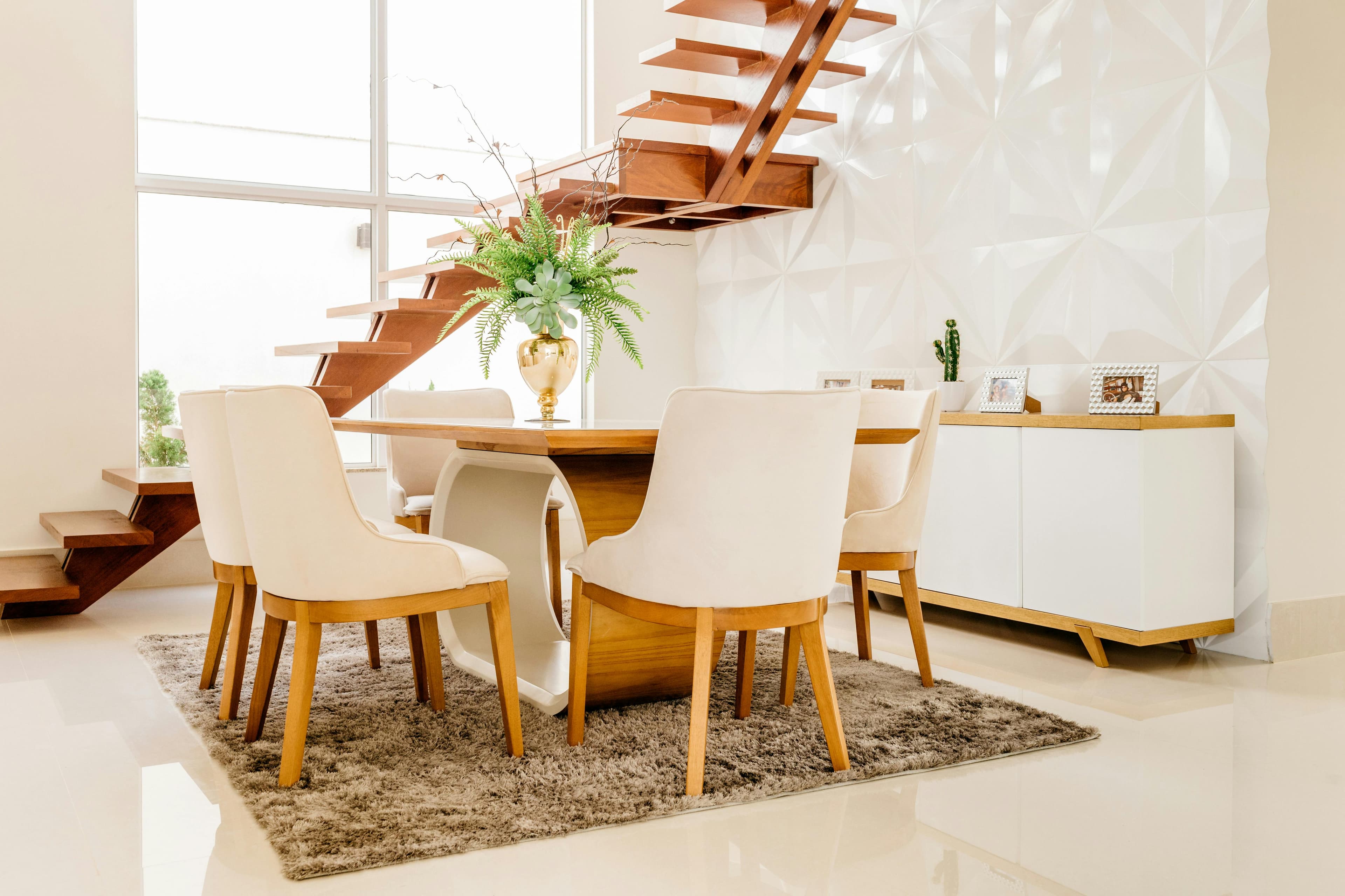 Elegant dining room with floating staircase