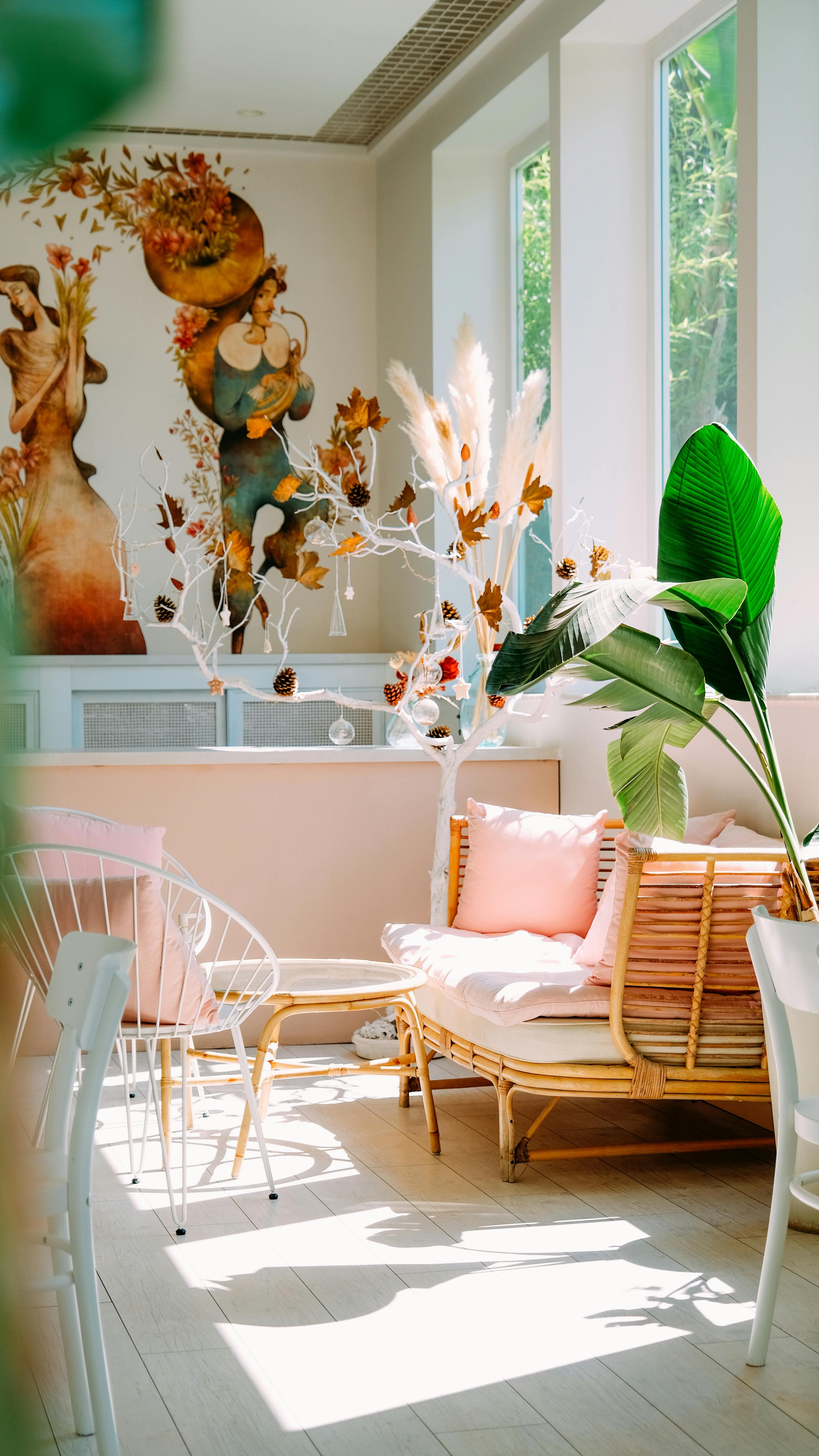 Botanical-inspired sunroom with rattan daybed