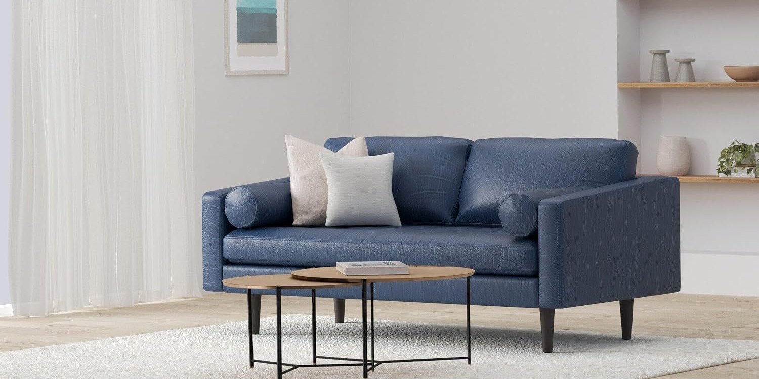 Poly & Bark Napa 72-inch midnight blue leather apartment sofa in a small bright living room